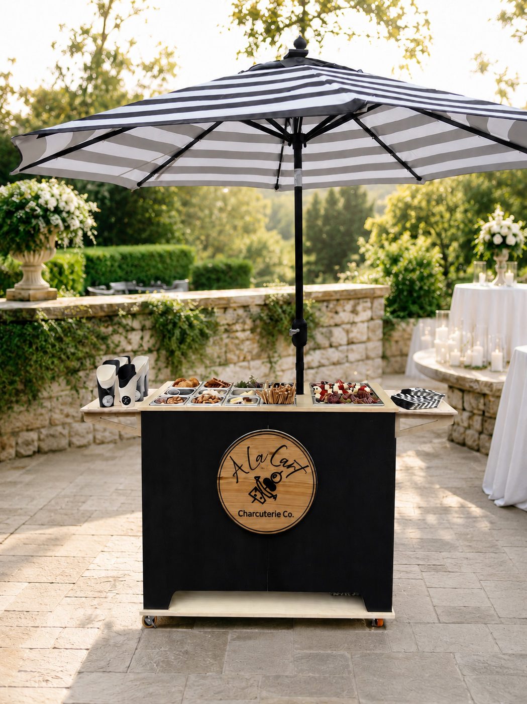 A La Cart charcuterie cart set up at a wedding reception